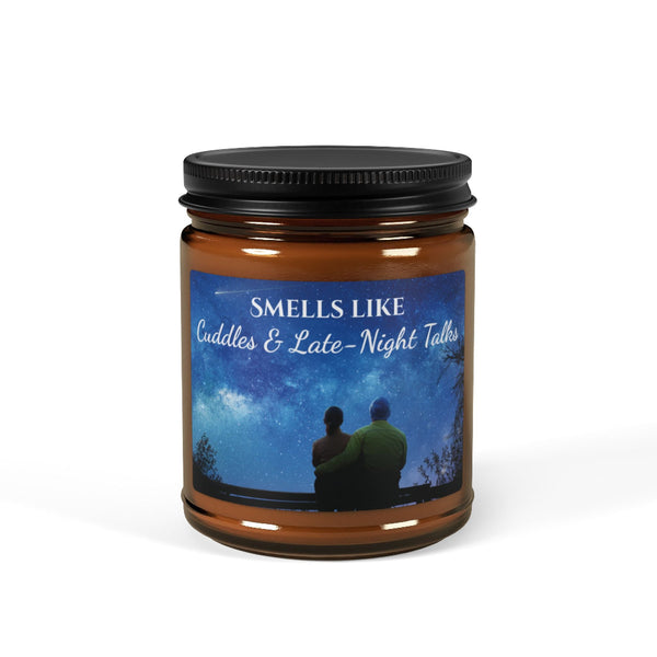 Candle jar with a label featuring an image of two people hugging under a starry sky and text 'Smells Like Cuddles & Late-Night Talks'.