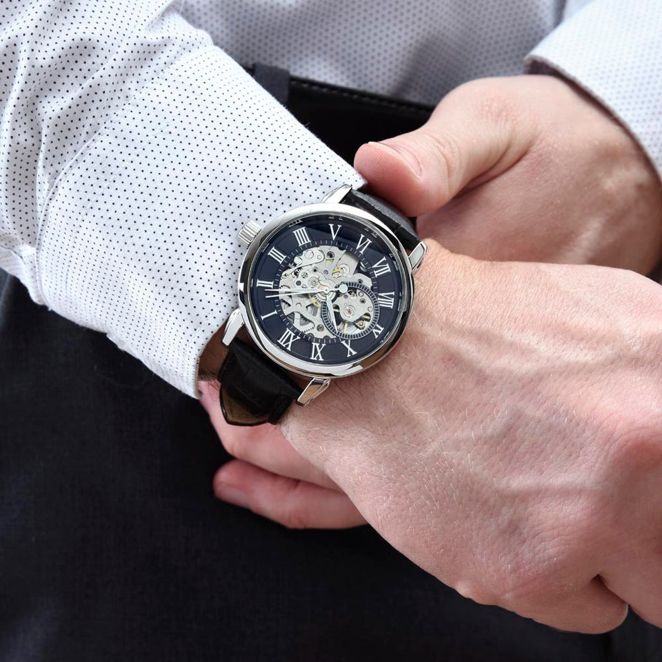 Close up of a man wearing a watch
