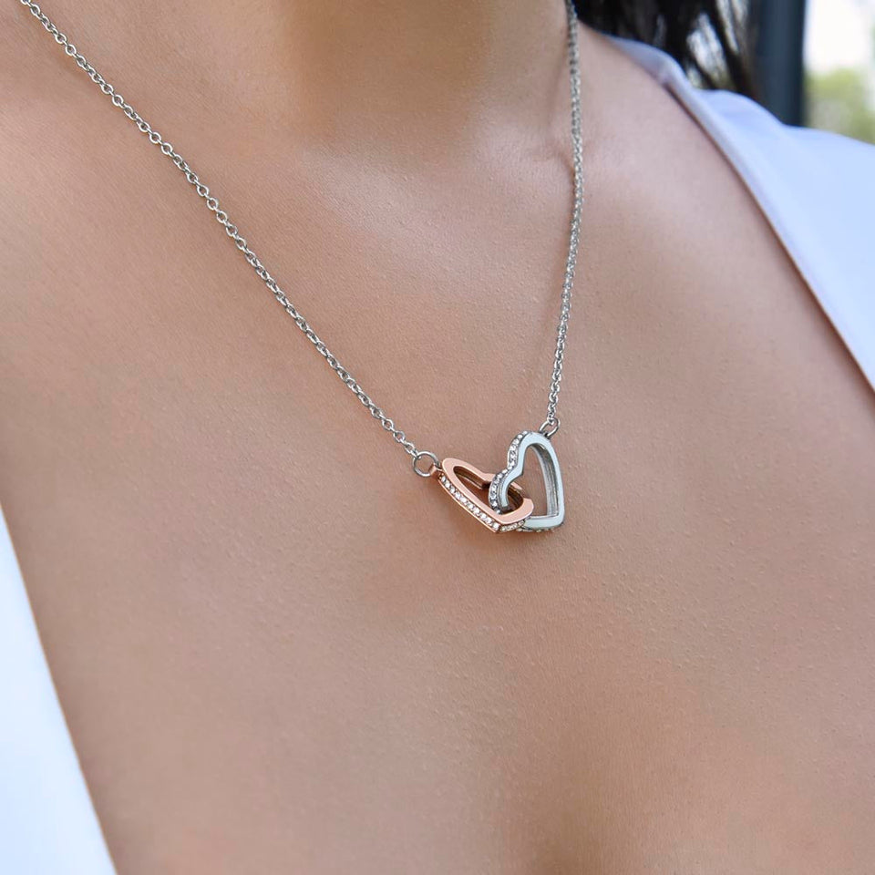 Woman wearing heart shape necklace