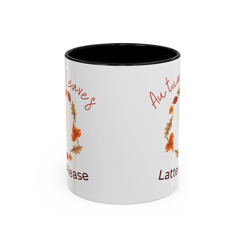 White mug with autumn-themed text and leaves on a white background