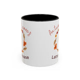 White mug with autumn-themed text and leaves on a white background