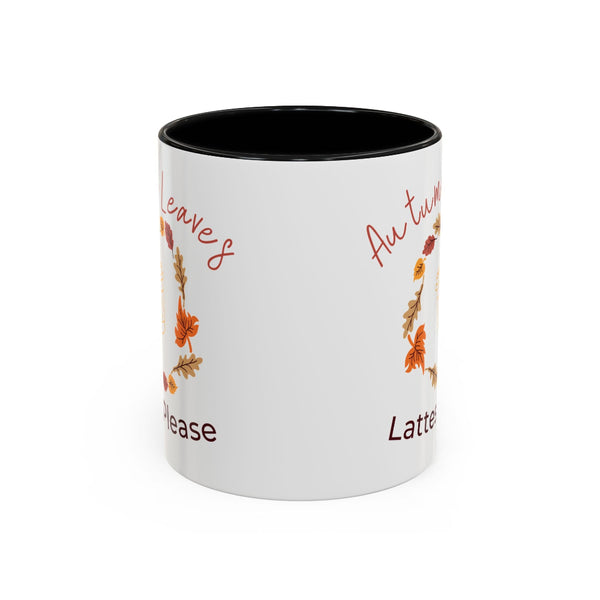 White mug with autumn-themed text and leaves on a white background