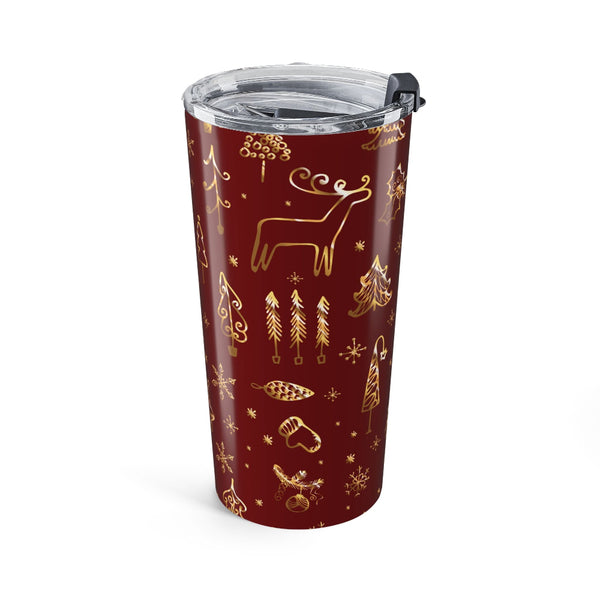 Red tumbler with gold Christmas-themed designs on a white background