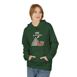 Person wearing a green hoodie with a festive design on a white background