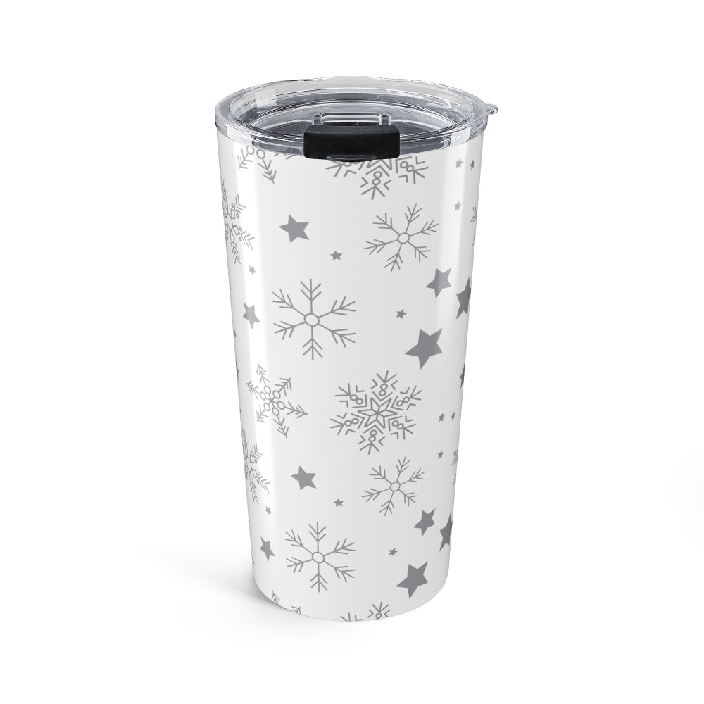 Clear tumbler with snowflake and star patterns on a white background