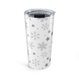 Clear tumbler with snowflake and star patterns on a white background