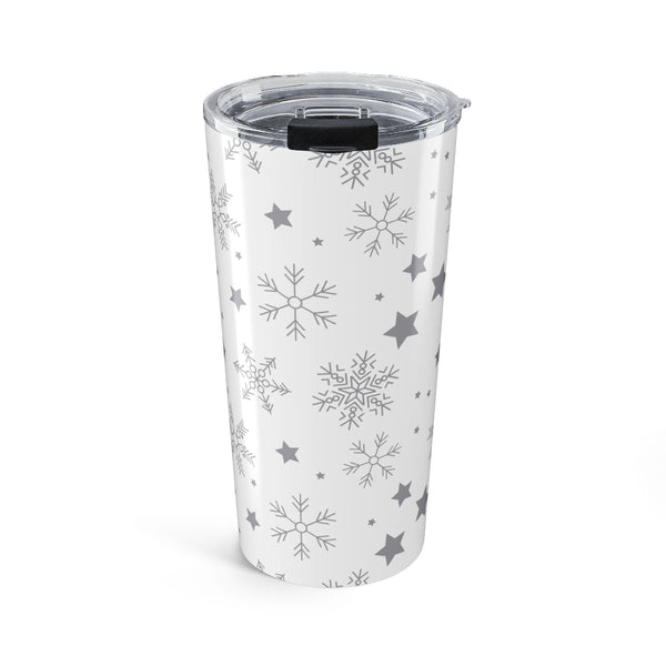 Clear tumbler with snowflake and star patterns on a white background