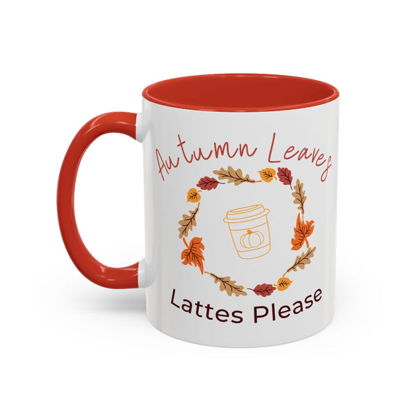 White mug with red interior and handle, featuring autumn-themed design and text.