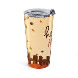 Tumbler with autumn design featuring leaves and pumpkins on a beige background