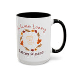 White mug with black interior and handle, featuring autumn-themed text and graphics.