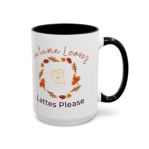 White mug with black interior and handle, featuring autumn-themed text and graphics.