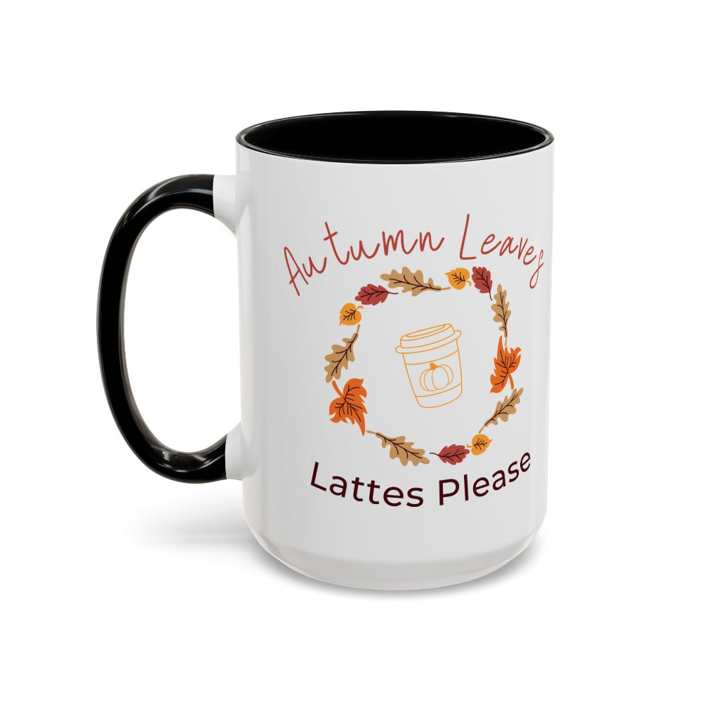 White mug with black interior and handle, featuring autumn-themed text and graphics.
