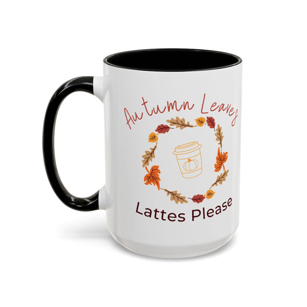 White mug with black interior and handle, featuring autumn-themed text and graphics.