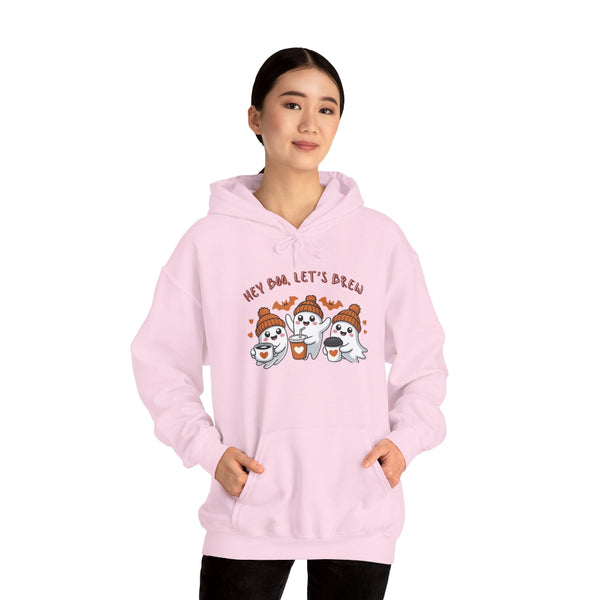 Person wearing a pink hoodie with cartoon characters and text on a white background
