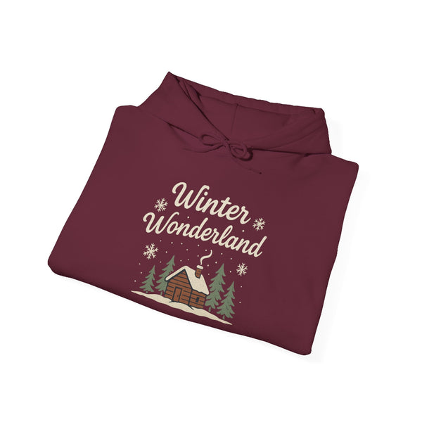 Folded maroon hoodie with 'Winter Wonderland' text and cabin design on a white background