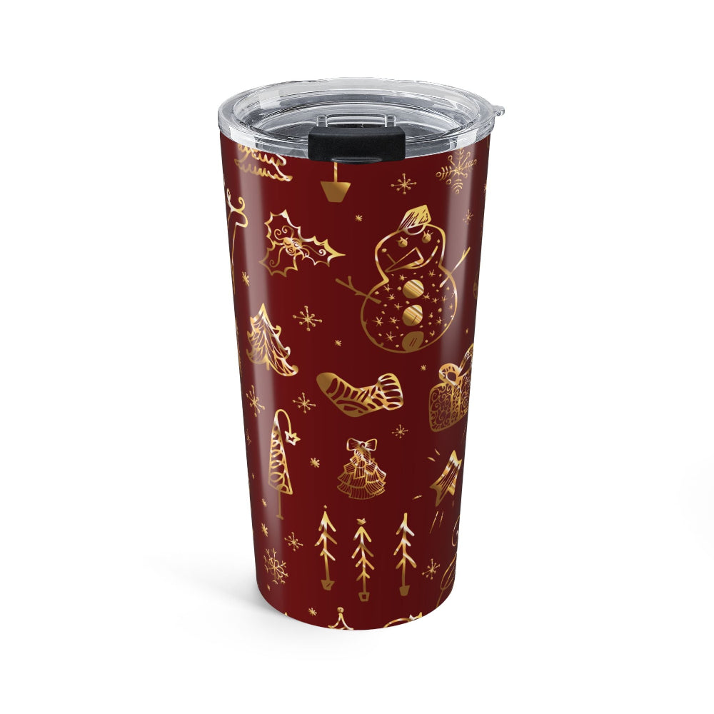 Red tumbler with gold Christmas-themed designs on a white background