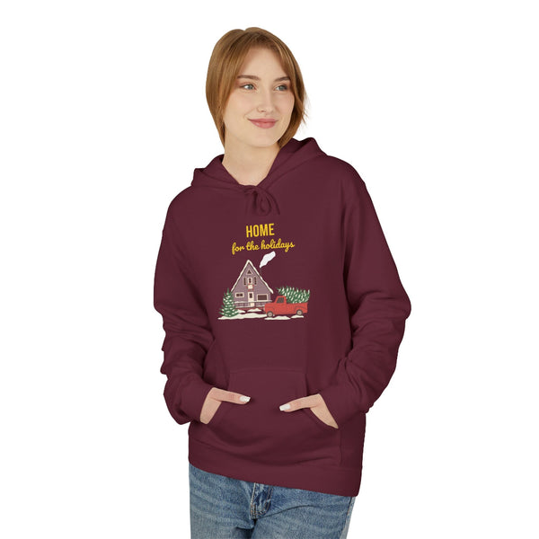 Person wearing a maroon hoodie with a holiday design on a white background