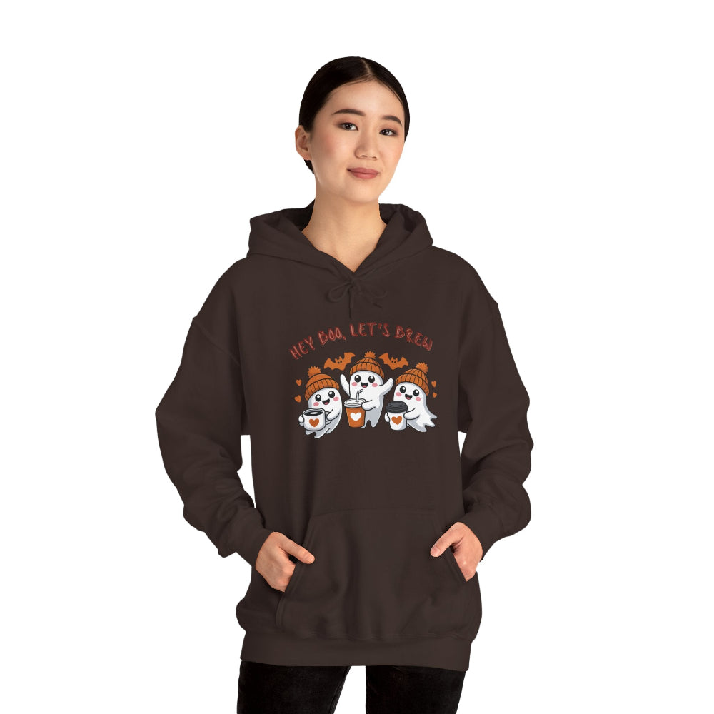 Person wearing a brown hoodie with ghost design and text on a white background