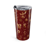 Red tumbler with gold Christmas-themed designs on a white background