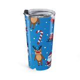 Tumbler with Christmas design featuring reindeer, candy canes, and Santa Claus on a blue background.