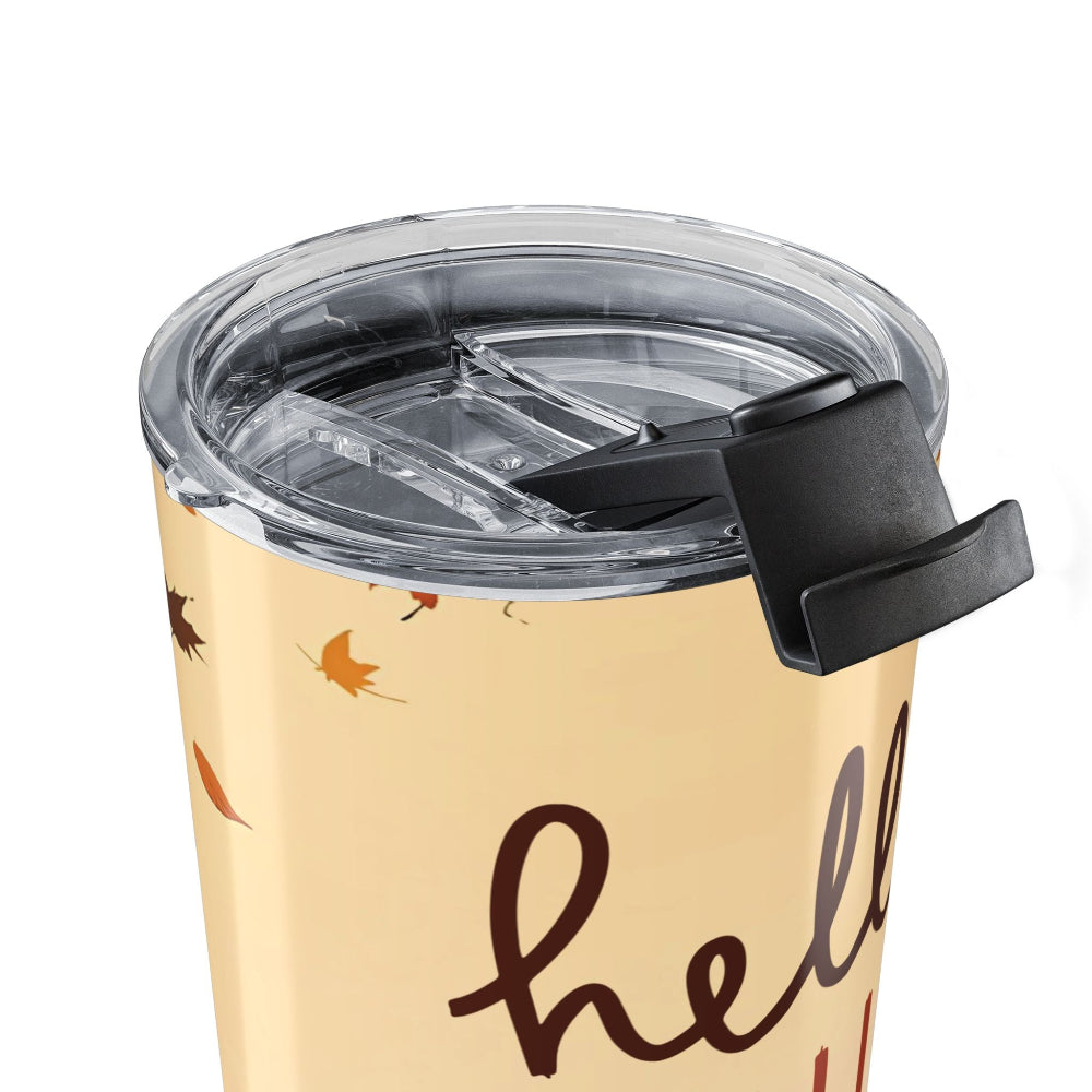 Beige tumbler with 'hello' text and autumn leaves design on a white background