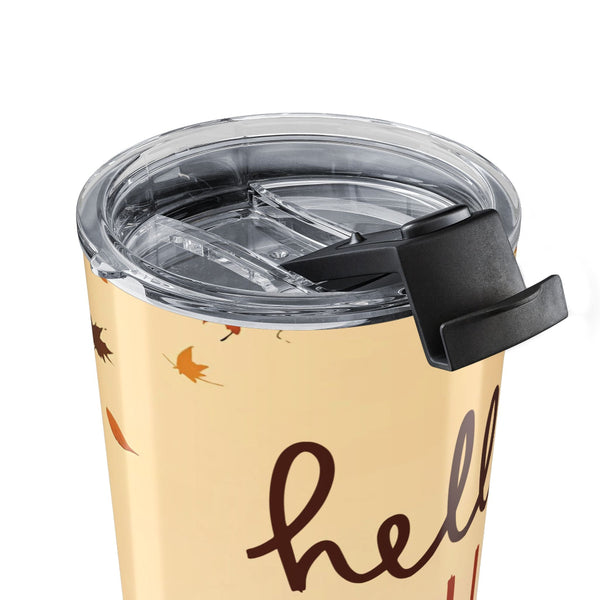 Beige tumbler with 'hello' text and autumn leaves design on a white background