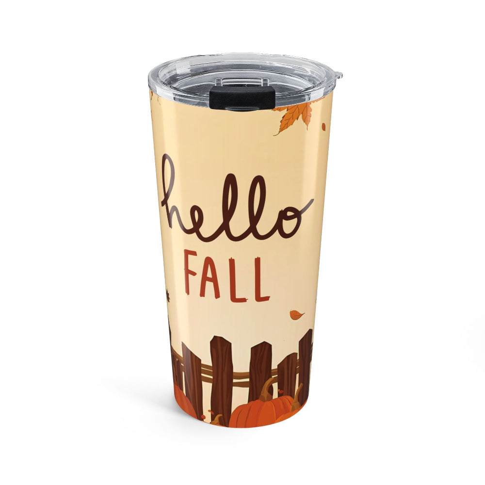 Tumbler with 'hello fall' text and autumn-themed design on a beige background