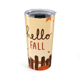 Tumbler with 'hello fall' text and autumn-themed design on a beige background