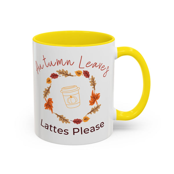 Mug with autumn-themed design and yellow handle on a white background