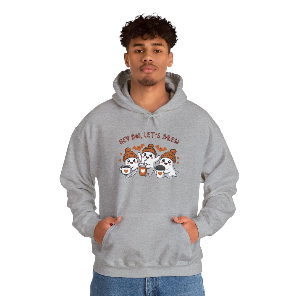 Person wearing a gray hoodie with cartoon ghosts and text on a white background