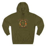 Green hoodie with autumn-themed design on a white background
