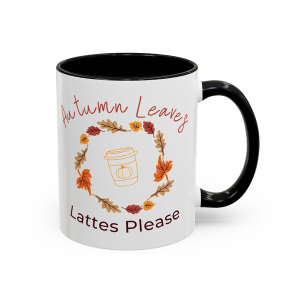 White mug with black interior and handle, featuring autumn-themed design and text.