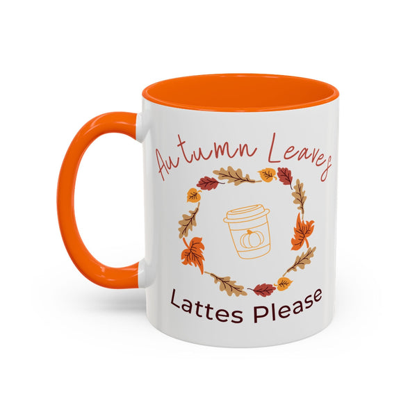 White mug with orange interior and handle, featuring autumn-themed design and text.