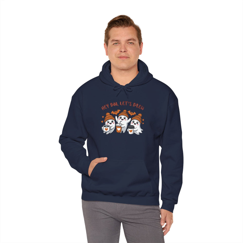 Man wearing a navy blue hoodie with ghost and pumpkin design on a white background