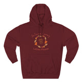 Maroon hoodie with autumn-themed design and text on a white background