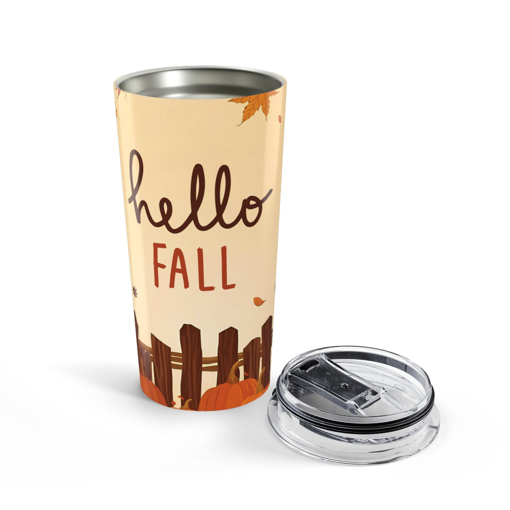 Tumbler with 'hello fall' text and autumn design on a white background