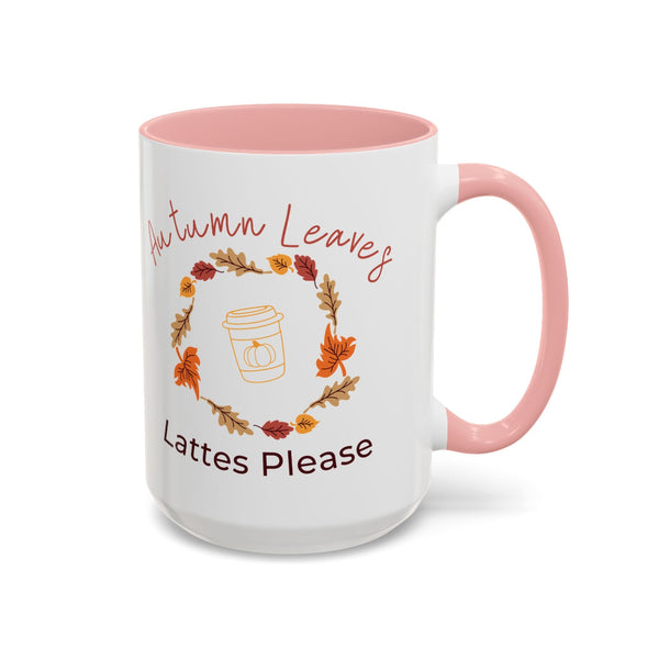 White mug with pink interior and handle, featuring autumn-themed text and graphics.