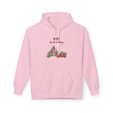 Pink hoodie with a Christmas design and text on a white background