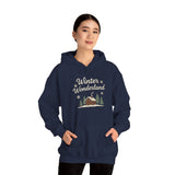 Navy blue hoodie with 'Winter Wonderland' design worn by a model on a white background