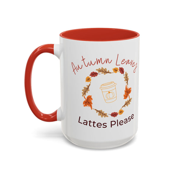 White mug with red interior and handle, featuring autumn-themed design and text.