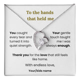Heart-shaped necklace with sentimental message on a card