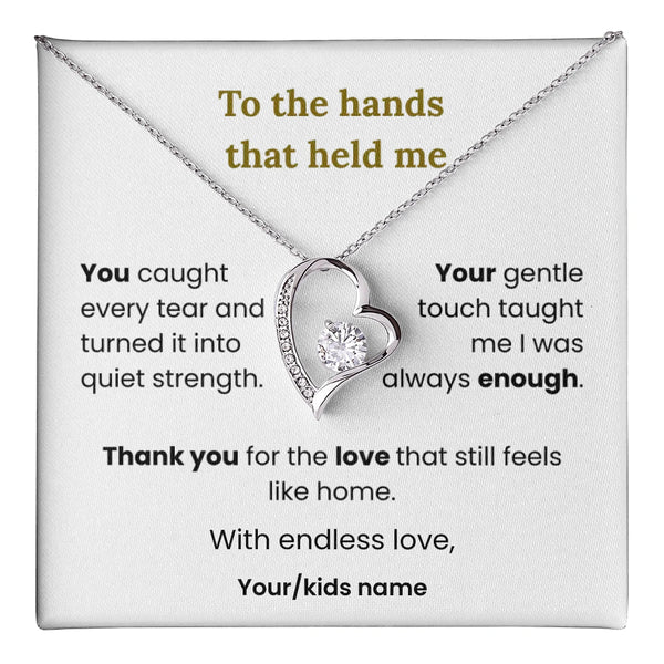 Heart-shaped necklace with sentimental message on a card