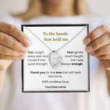 Heart-shaped necklace in a personalized message box held by hands