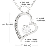 Heart-shaped pendant with adjustable chain and cubic zirconia center on a white background