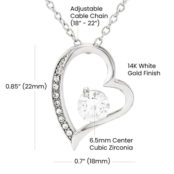 Heart-shaped pendant with adjustable chain and cubic zirconia center on a white background