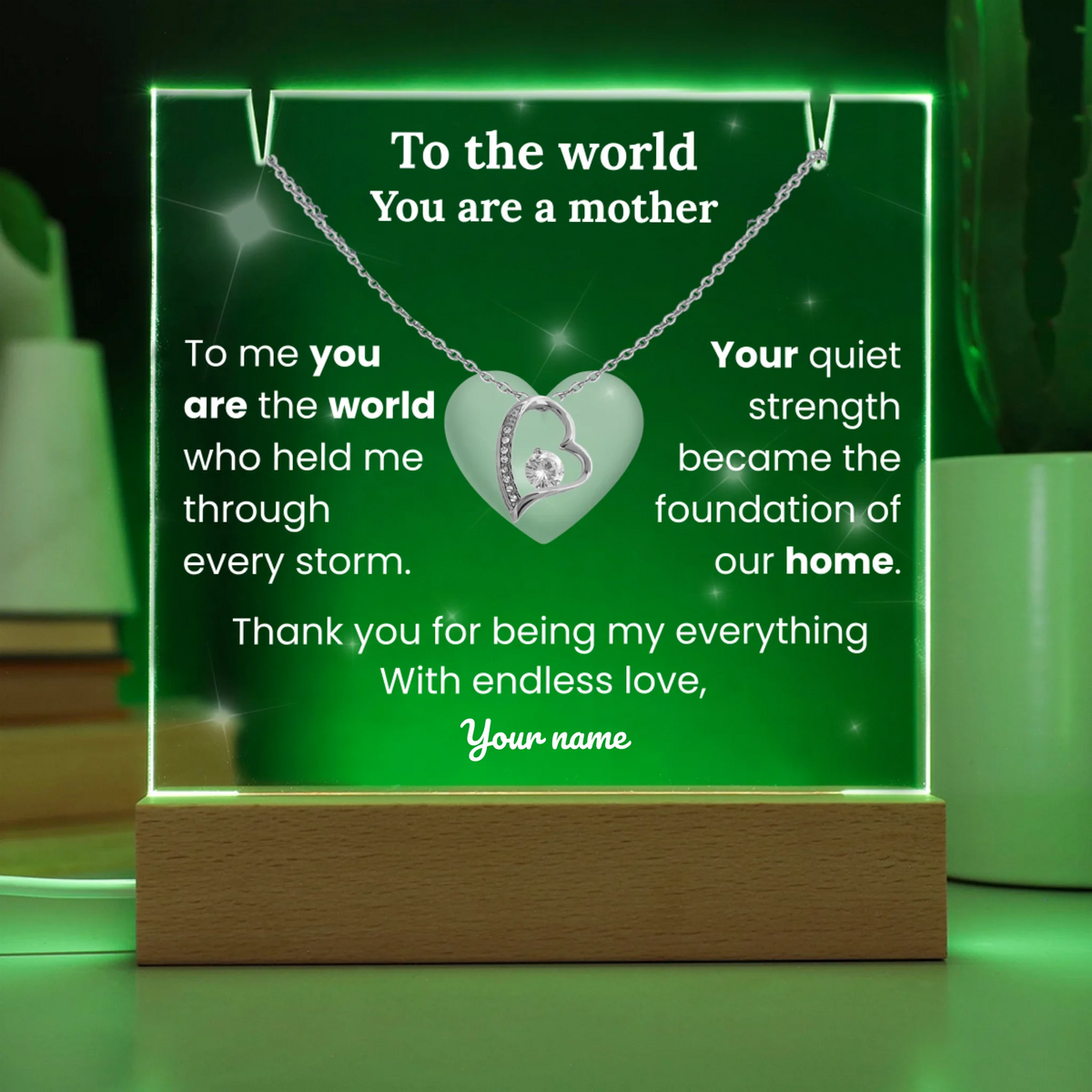Decorative plaque with a necklace design and text on a green background