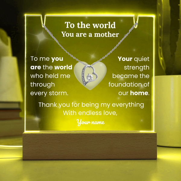 Necklace with heart pendant on a glowing stand with sentimental text