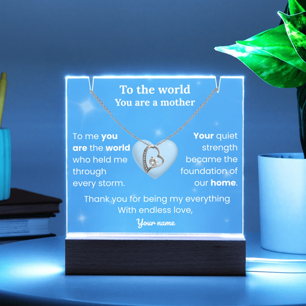 Necklace with heart pendant on a glowing stand with personalized message