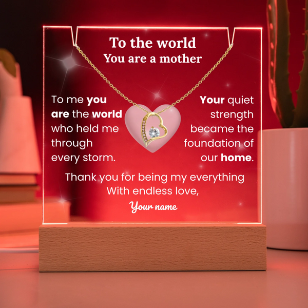 Heart-shaped necklace with sentimental message on a red background