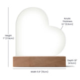 Heart-shaped object with measurements on a white background